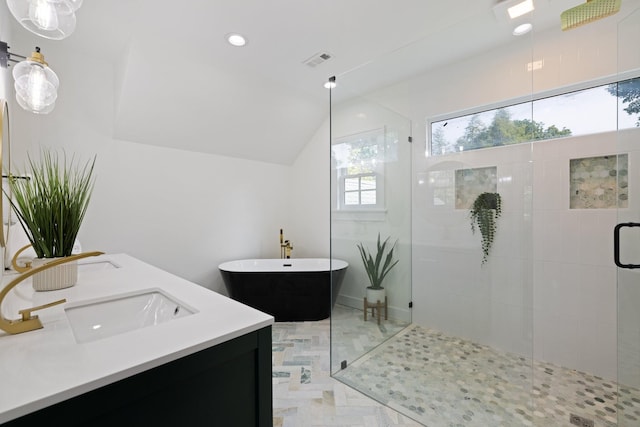 bathroom featuring vanity and plus walk in shower