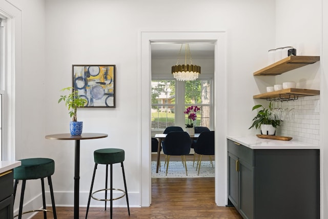 interior space featuring an inviting chandelier and dark hardwood / wood-style floors