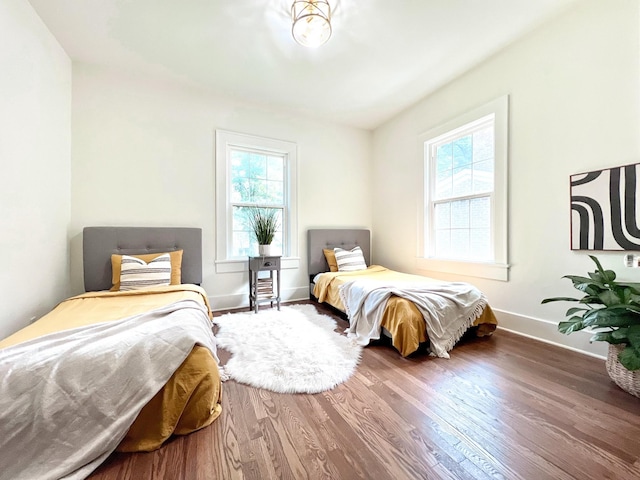 bedroom with wood-type flooring