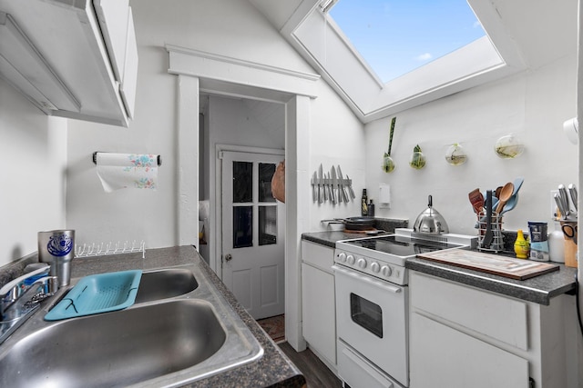 kitchen featuring white cabinetry, dark hardwood / wood-style flooring, electric stove, sink, and lofted ceiling with skylight