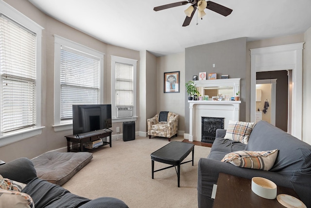 carpeted living room with ceiling fan and cooling unit