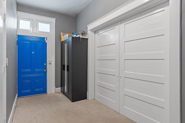 entryway with light colored carpet