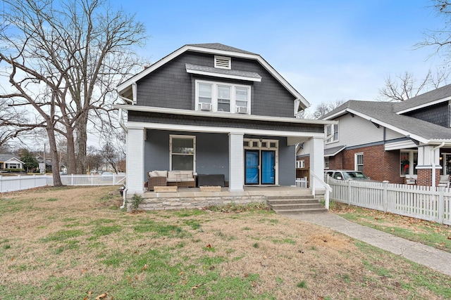 view of front of house with a front yard and a porch