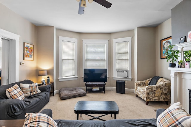 living room with cooling unit, carpet, and ceiling fan