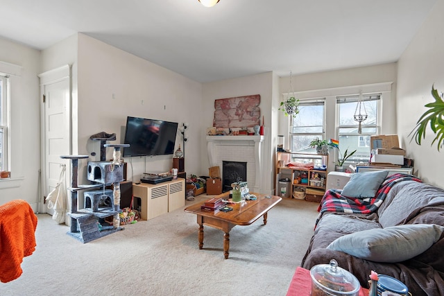 carpeted living room featuring a brick fireplace