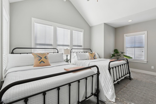 carpeted bedroom with vaulted ceiling