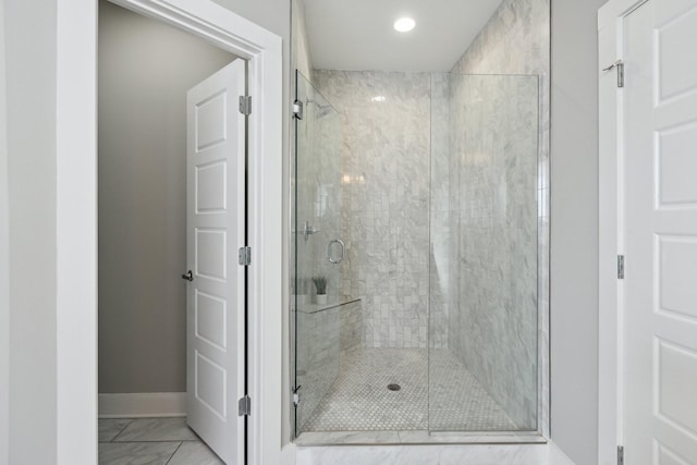 bathroom with a shower with shower door