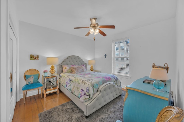 bedroom featuring ceiling fan and hardwood / wood-style flooring