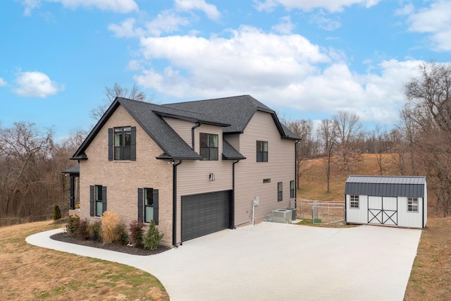 view of home's exterior with a garage, central AC, and a storage unit