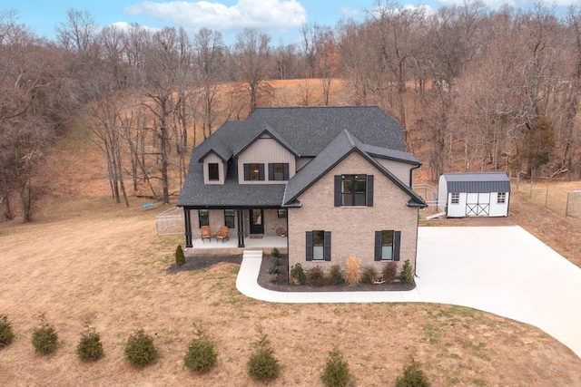 view of front of house with covered porch, central air condition unit, a front lawn, and a storage unit