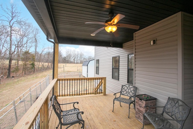 wooden terrace featuring ceiling fan