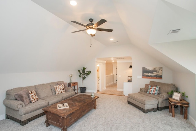 living room featuring ceiling fan, light colored carpet, and lofted ceiling