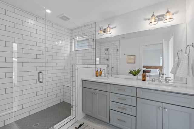 bathroom featuring walk in shower and vanity