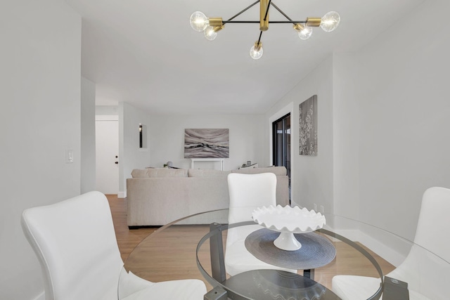 dining area with hardwood / wood-style flooring