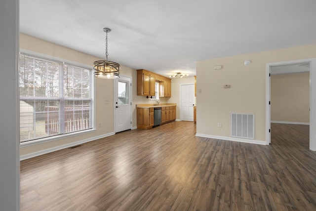 unfurnished living room featuring dark hardwood / wood-style flooring