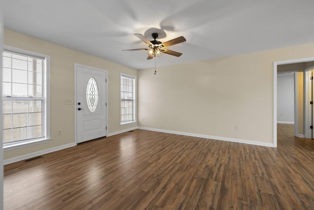 foyer with ceiling fan and dark hardwood / wood-style flooring