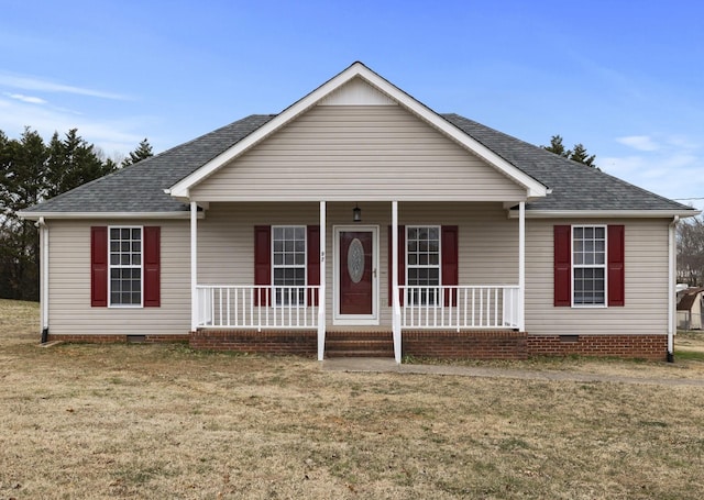 view of front facade featuring covered porch and a front lawn