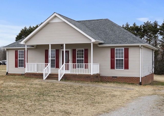 view of front of property featuring covered porch and a front yard