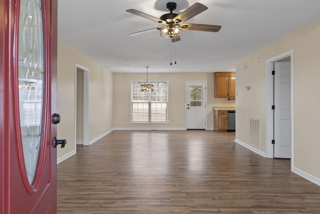 unfurnished living room with dark wood-type flooring and ceiling fan