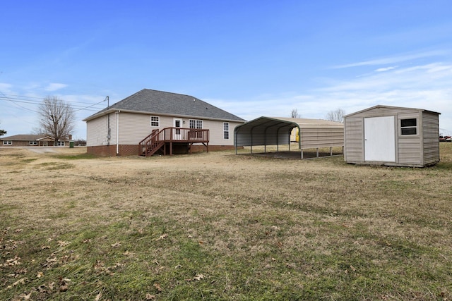 rear view of property featuring a wooden deck, a storage unit, a lawn, and a carport