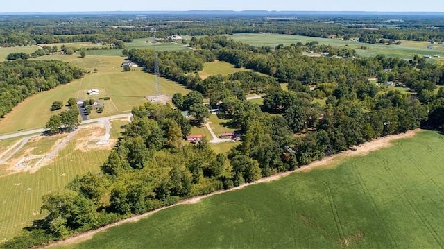 birds eye view of property with a rural view