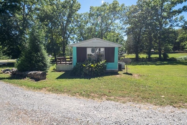 view of outdoor structure with a lawn