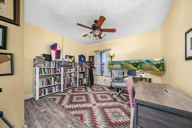 home office featuring ceiling fan and a textured ceiling