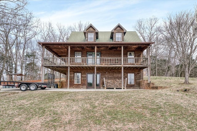 log-style house with a front yard