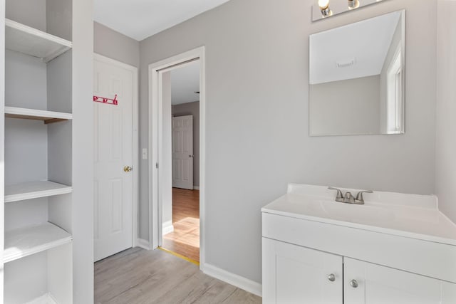 bathroom with wood-type flooring and vanity