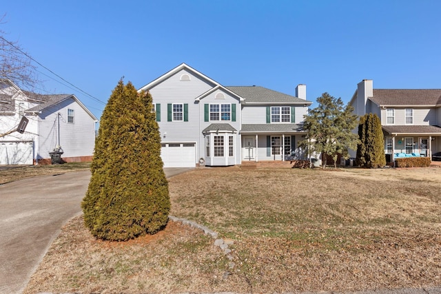 front facade featuring a front yard and a garage