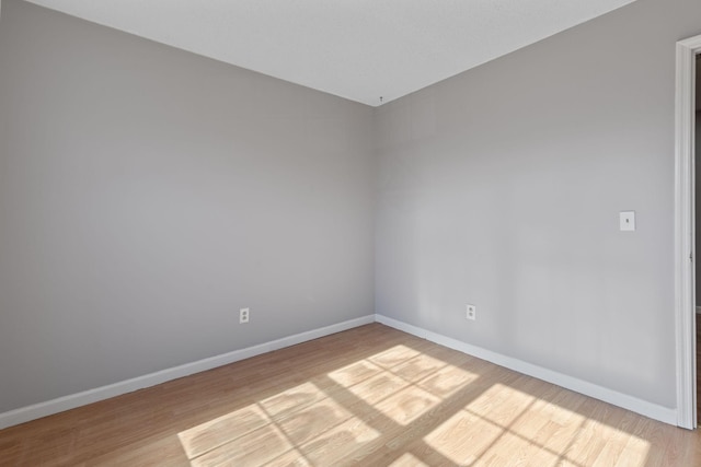 empty room with light wood-type flooring