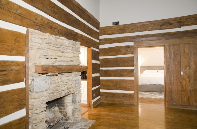 unfurnished living room with dark hardwood / wood-style flooring and a fireplace