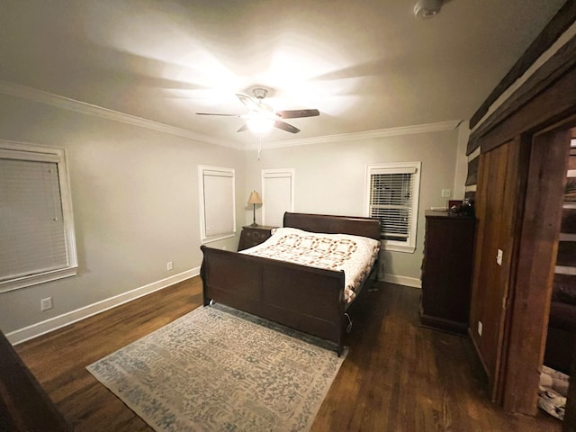 bedroom with crown molding, ceiling fan, and dark hardwood / wood-style floors