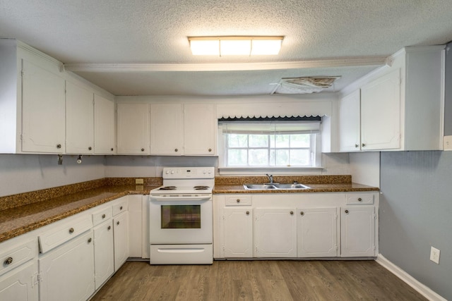 kitchen with sink, electric range, white cabinets, and a textured ceiling