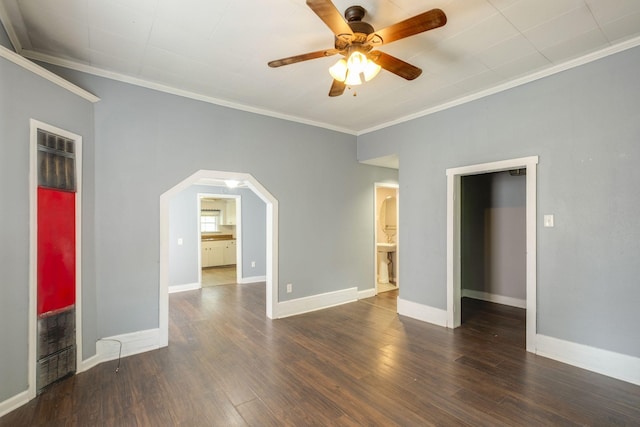 unfurnished bedroom with ornamental molding, dark wood-type flooring, and ceiling fan