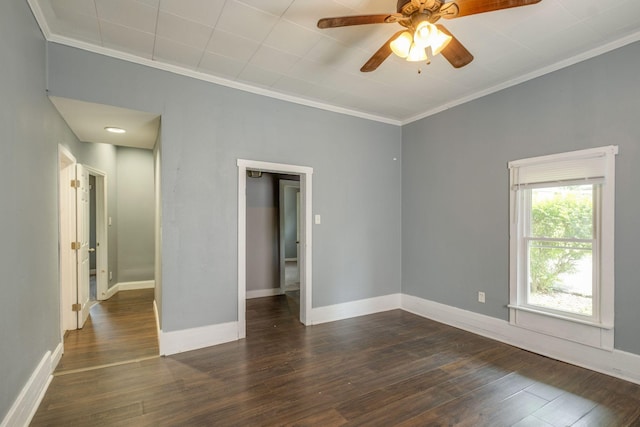 unfurnished room featuring crown molding, dark hardwood / wood-style floors, and ceiling fan