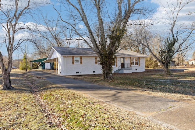 view of front of home with a carport