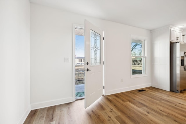 entrance foyer featuring light hardwood / wood-style floors