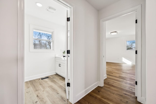 corridor featuring light wood-type flooring