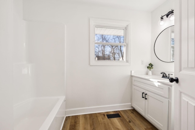 bathroom with vanity and hardwood / wood-style floors