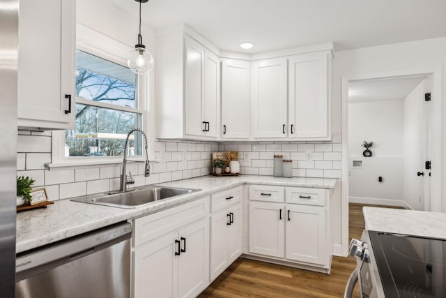 kitchen with sink, white cabinetry, and appliances with stainless steel finishes