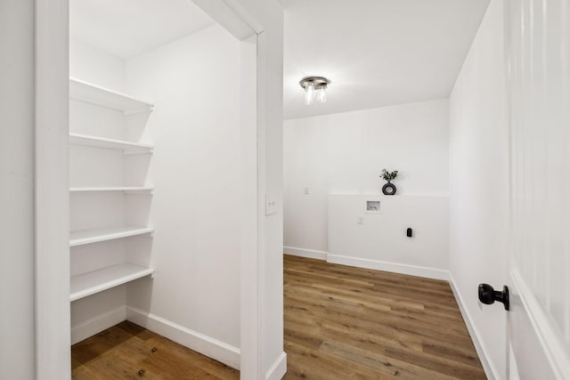 laundry area featuring hardwood / wood-style floors, washer hookup, and electric dryer hookup