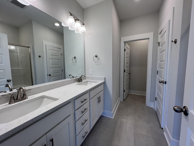 bathroom with an enclosed shower and vanity