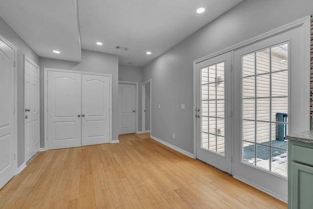 interior space featuring light wood-type flooring and access to outside