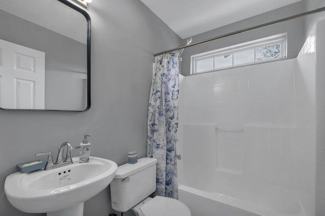 full bathroom with sink, toilet, and shower / bath combination with curtain