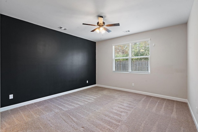 empty room with carpet floors and ceiling fan