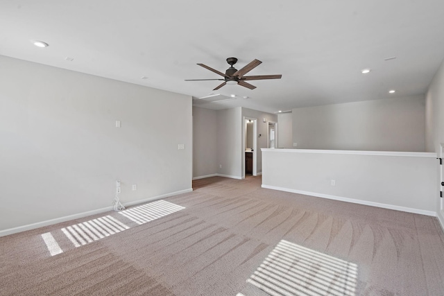 carpeted empty room featuring ceiling fan