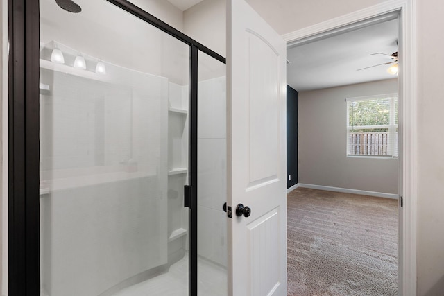 bathroom with ceiling fan and walk in shower