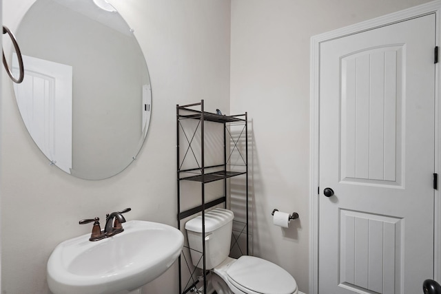 bathroom with sink and toilet