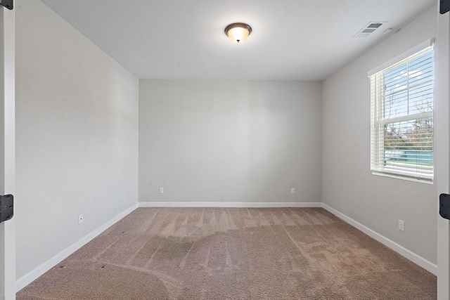 unfurnished room with carpet floors